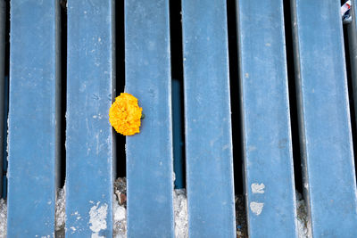 Yellow metal on wood