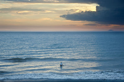 Scenic view of sea against sky during sunset