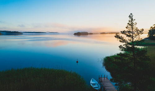 Scenic view to sea against sky during sunrise