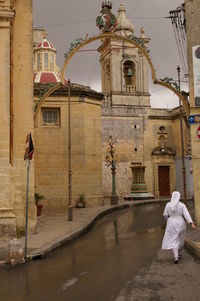 Rear view of a man walking in temple