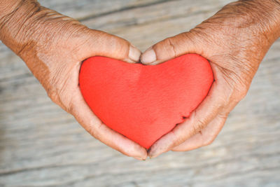 Close-up of hands holding heart shape