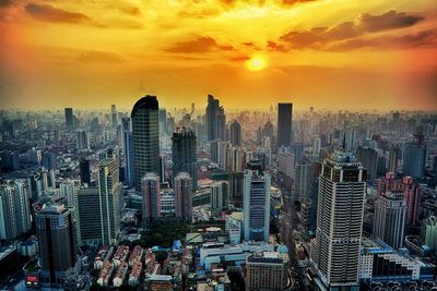 Cityscape against sky during sunset