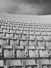 Low angle view of empty chairs at stadium