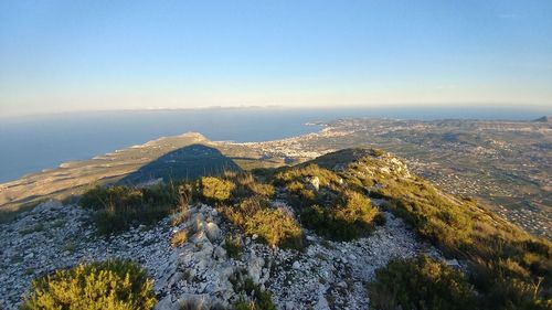 Scenic view of mountains against clear blue sky