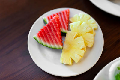 High angle view of fruits in plate on table