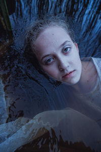 Portrait of teenager girl woman in water