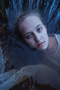 Portrait of a young woman lying down