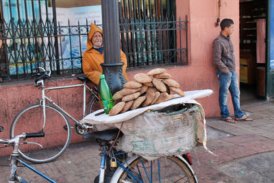 Man with bicycle on street