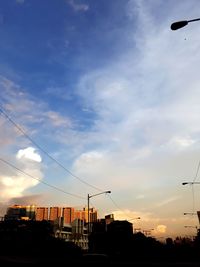 Low angle view of buildings against sky during sunset