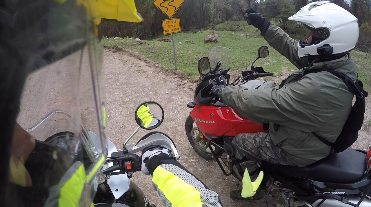 PERSON RIDING MOTORCYCLE ON ROAD