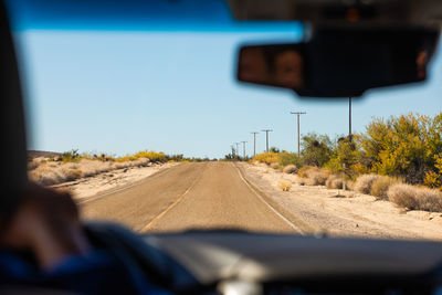 Road seen through car windshield