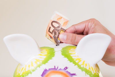 Close-up of hand holding table