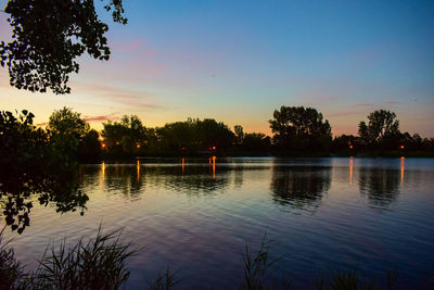 Scenic view of lake against sky during sunset