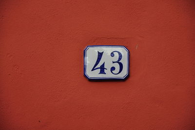 Close-up of information sign on wall