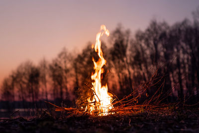 Bonfire against sky at sunset