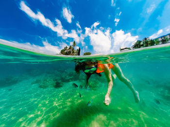 People swimming in sea. dom gopro case . underwater sri-lanka