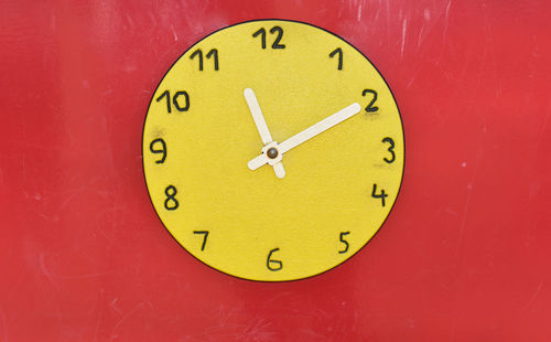 Close-up of clock on wall