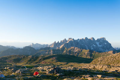 Scenic view of mountains against clear blue sky