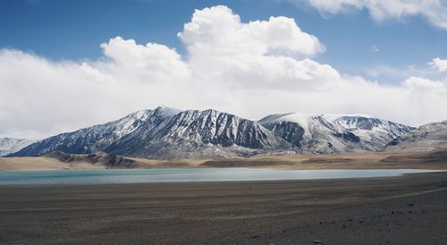 Scenic view of snowcapped mountains against sky