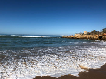 Scenic view of sea against clear sky