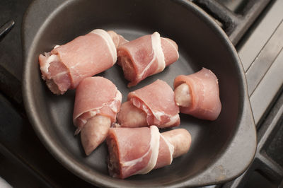 High angle view of raw pork in container