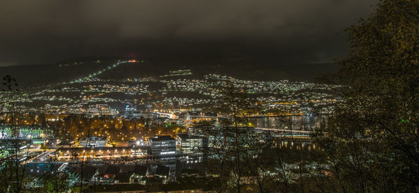 High angle view of illuminated buildings in city at night