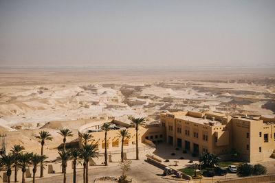 Aerial view of city buildings against clear sky
