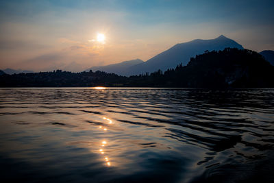 Scenic view of lake against sky during sunset