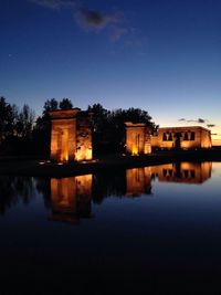Reflection of illuminated buildings in water