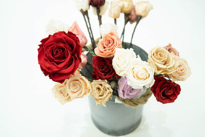 High angle view of rose bouquet against white background