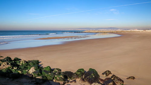 Scenic view of beach against sky