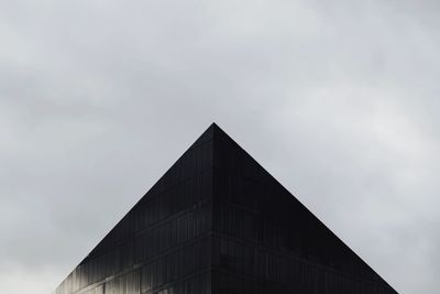 Low angle view of office building against sky