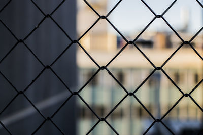 Full frame shot of chainlink fence against sky