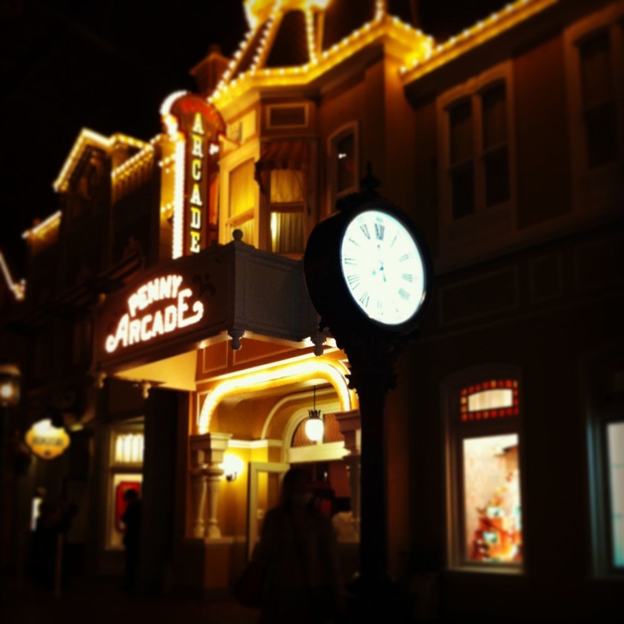 illuminated, night, text, clock, communication, time, built structure, architecture, low angle view, building exterior, western script, lighting equipment, number, clock tower, non-western script, information sign, circle, sign, outdoors, lantern