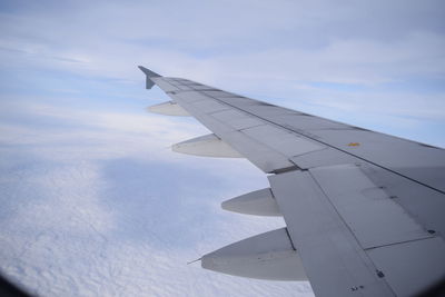 Low angle view of airplane flying in sky