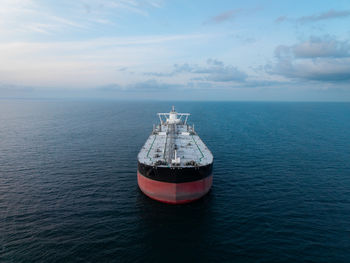 Aerial view above a crude oil tanker ship on at sea transporting oil and petroleum around the world