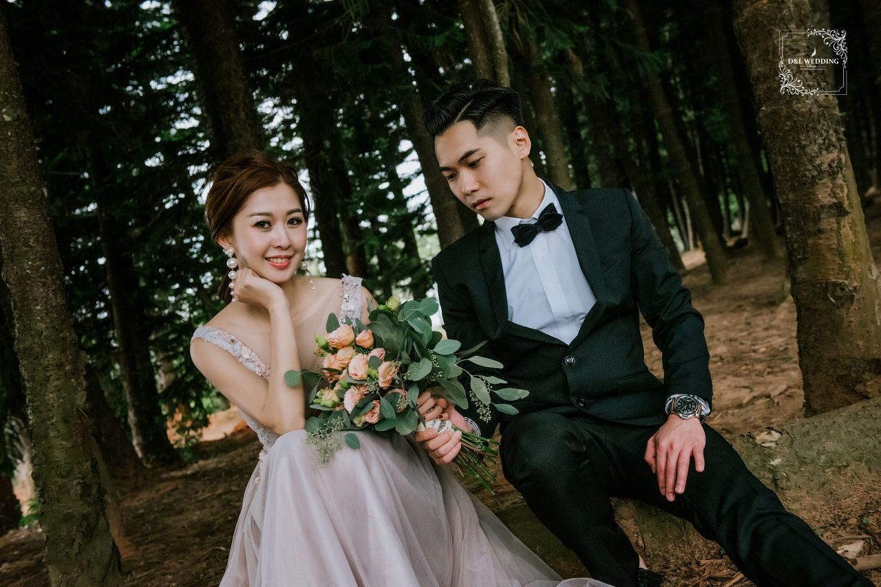 couple - relationship, two people, young adult, tree, togetherness, young men, newlywed, wedding, three quarter length, bride, plant, formalwear, young women, heterosexual couple, emotion, young couple, women, love, well-dressed, bridegroom, husband, wife, positive emotion