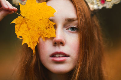 Close-up portrait of woman holding girl