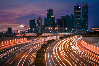 Light trails on road in city at night