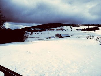 Scenic view of snow covered mountains against sky
