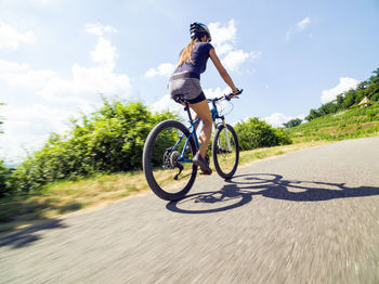 Man riding bicycle on road