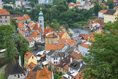 High angle view of buildings and trees in city