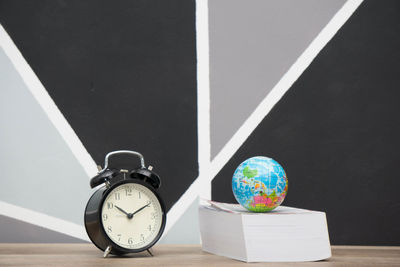 Close-up of clock on table