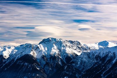 Scenic view of snowcapped mountains against sky 