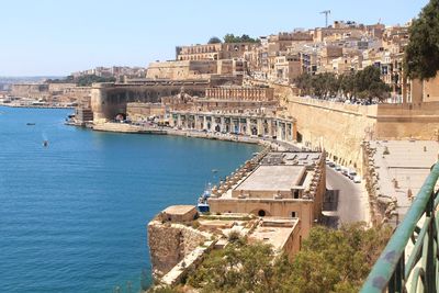 High angle view of the waterfront and harbour of valletta from the lower barrakka gardens. 