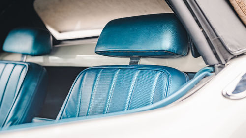 Blue driver's seat of a classic american sportscar