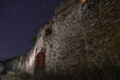 Low angle view of building against sky at night