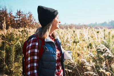 Woman taking break and enjoying the coffee during vacation trip. spending vacations close to nature