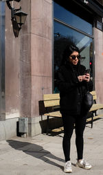 Full length of man wearing sunglasses standing outdoors