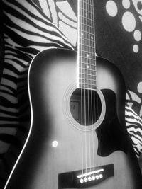 Close-up of guitar on table